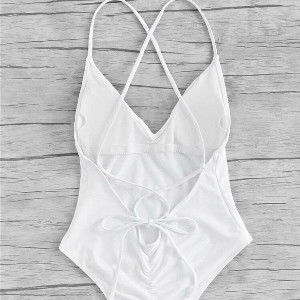 White one piece swimsuit. Brand new & never used